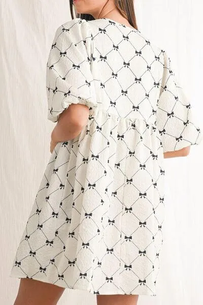 Got the Allure Bow Print Tie Neck Bubble Sleeve Dress in White and Black