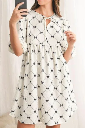Got the Allure Bow Print Tie Neck Bubble Sleeve Dress in White and Black