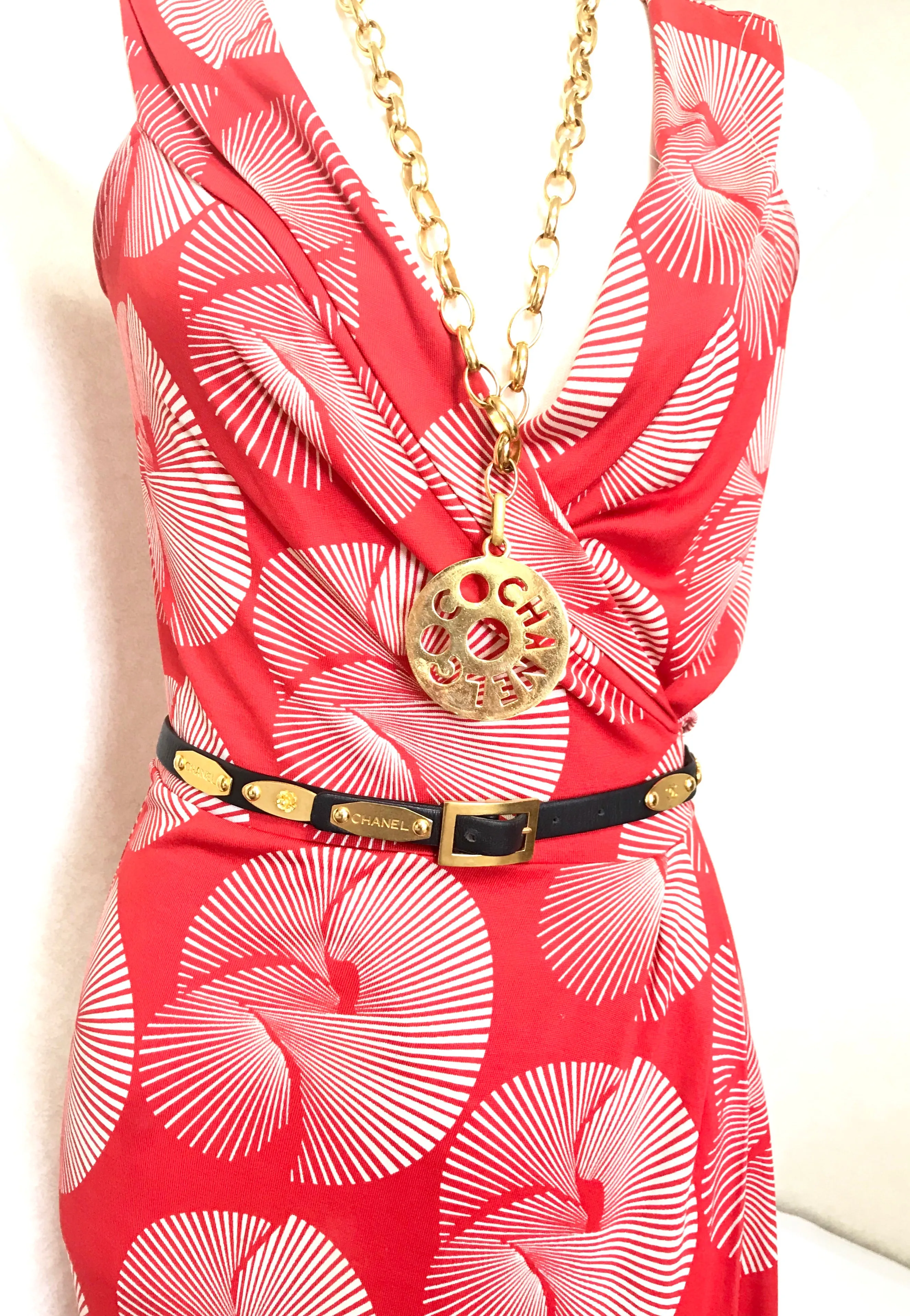Vintage CHANEL black belt with golden buckle and iconic logo motifs, CC mark, camellia flower, turtle, perfume, clover. R0410113