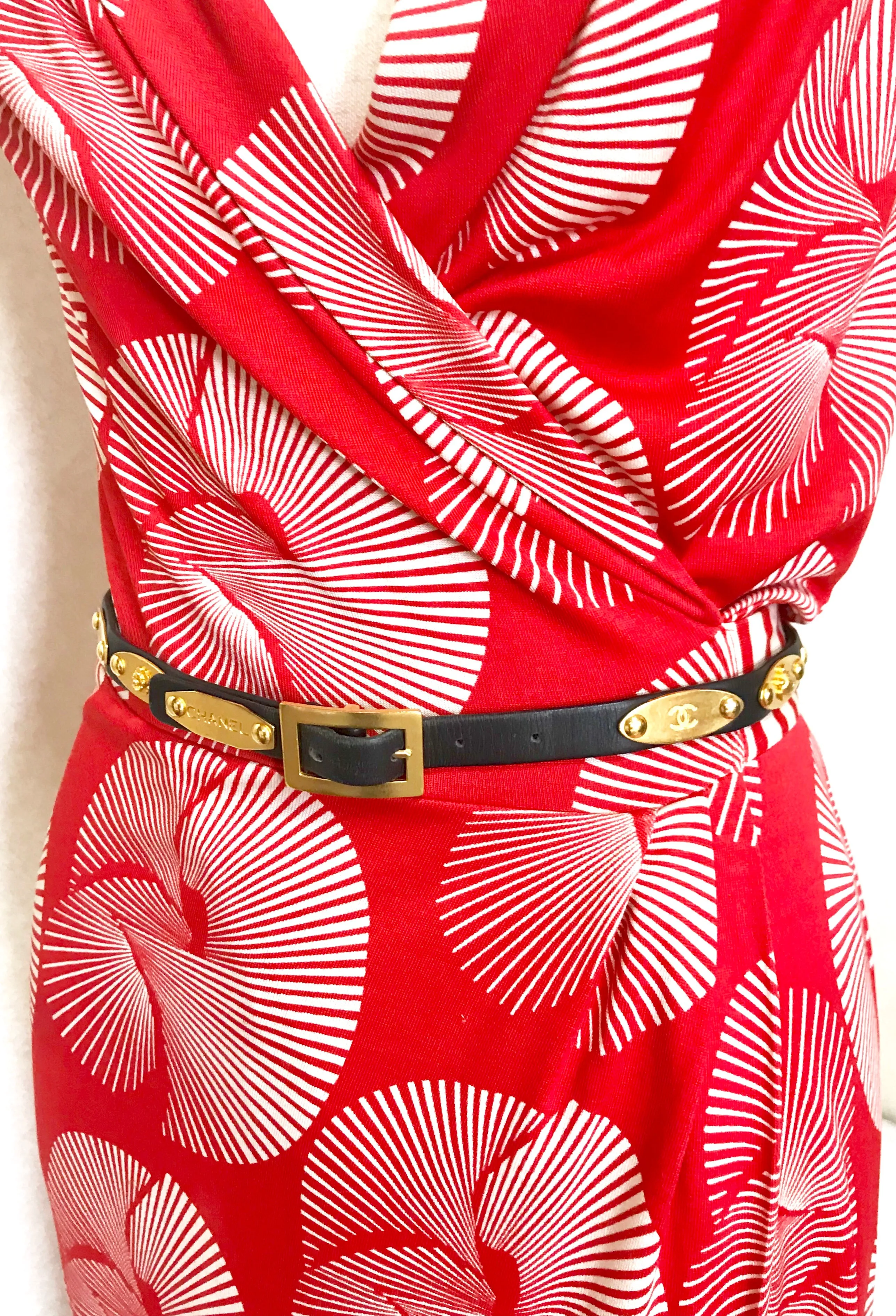 Vintage CHANEL black belt with golden buckle and iconic logo motifs, CC mark, camellia flower, turtle, perfume, clover. R0410113